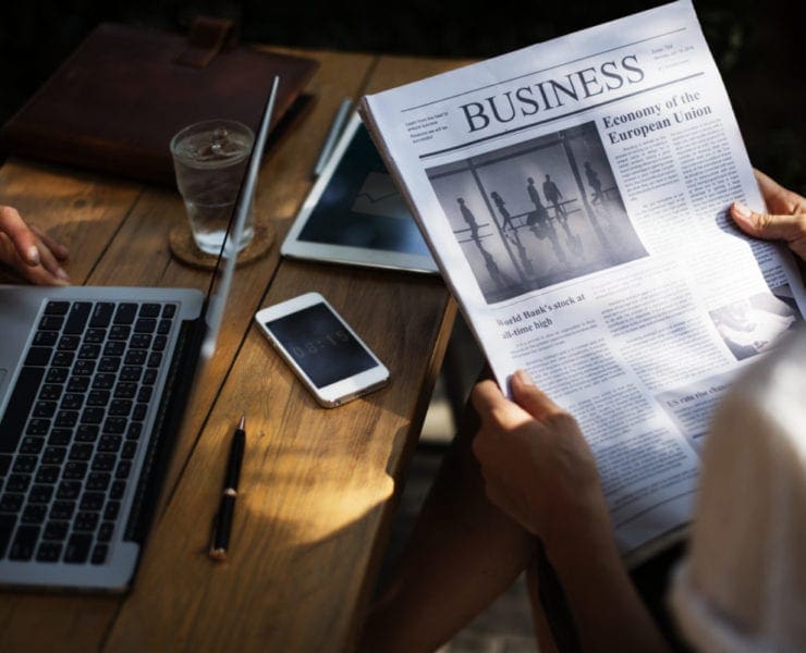 woman reading business news