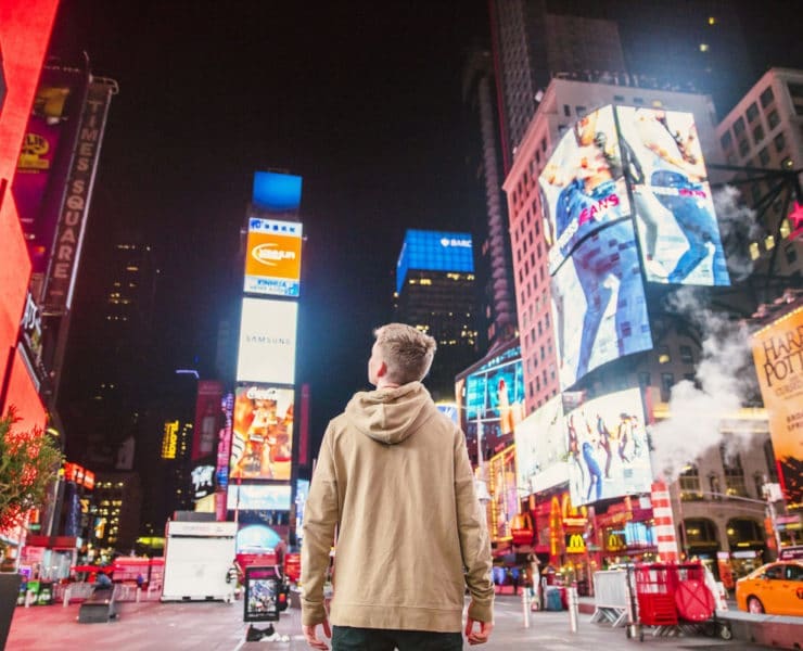 boy amazed by times square ad boards
