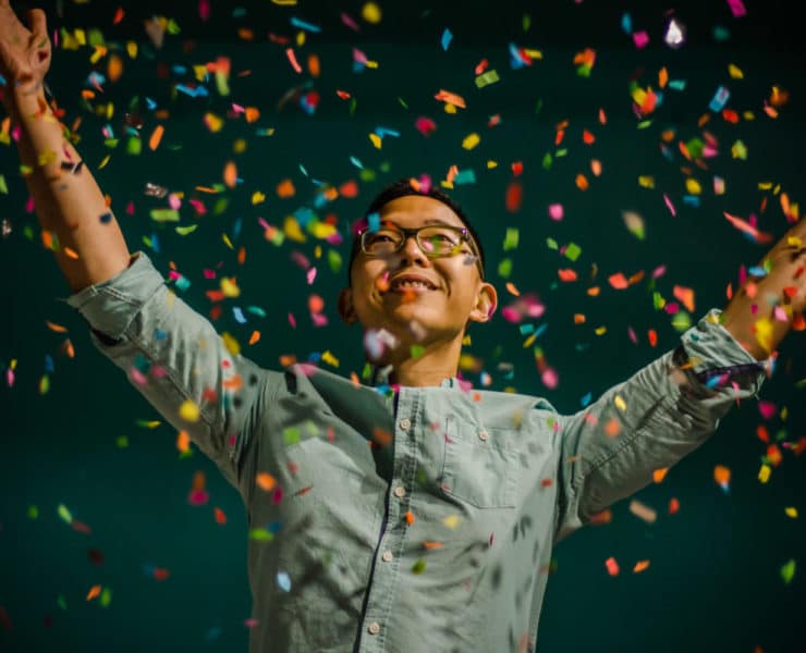 Woman celebrating with confetti