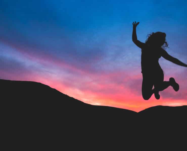 silhouette of woman jumping