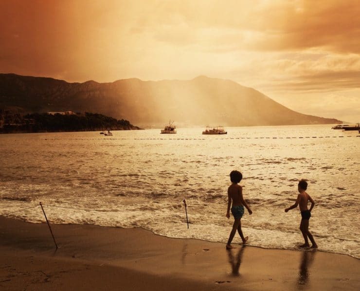 kids enjoying sunset at beach