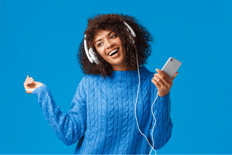happy woman listening to free music downloads