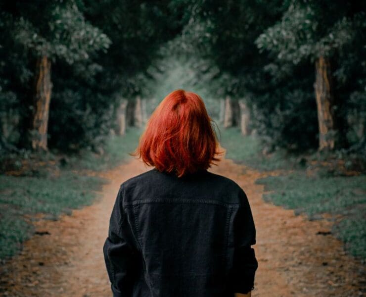 Person walking forward along a quiet path symbolising a new beginning