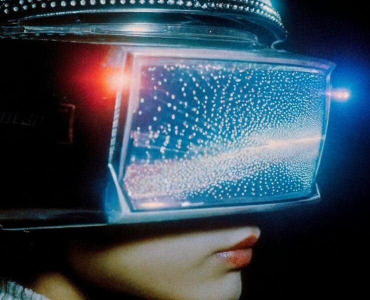 Futuristic neon visor reflecting digital light, representing forward-looking technology and electronic innovation