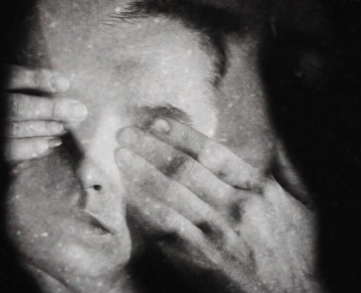 Crime investigation background music artwork for Silent Witness featuring a distressed witness covering their eyes.